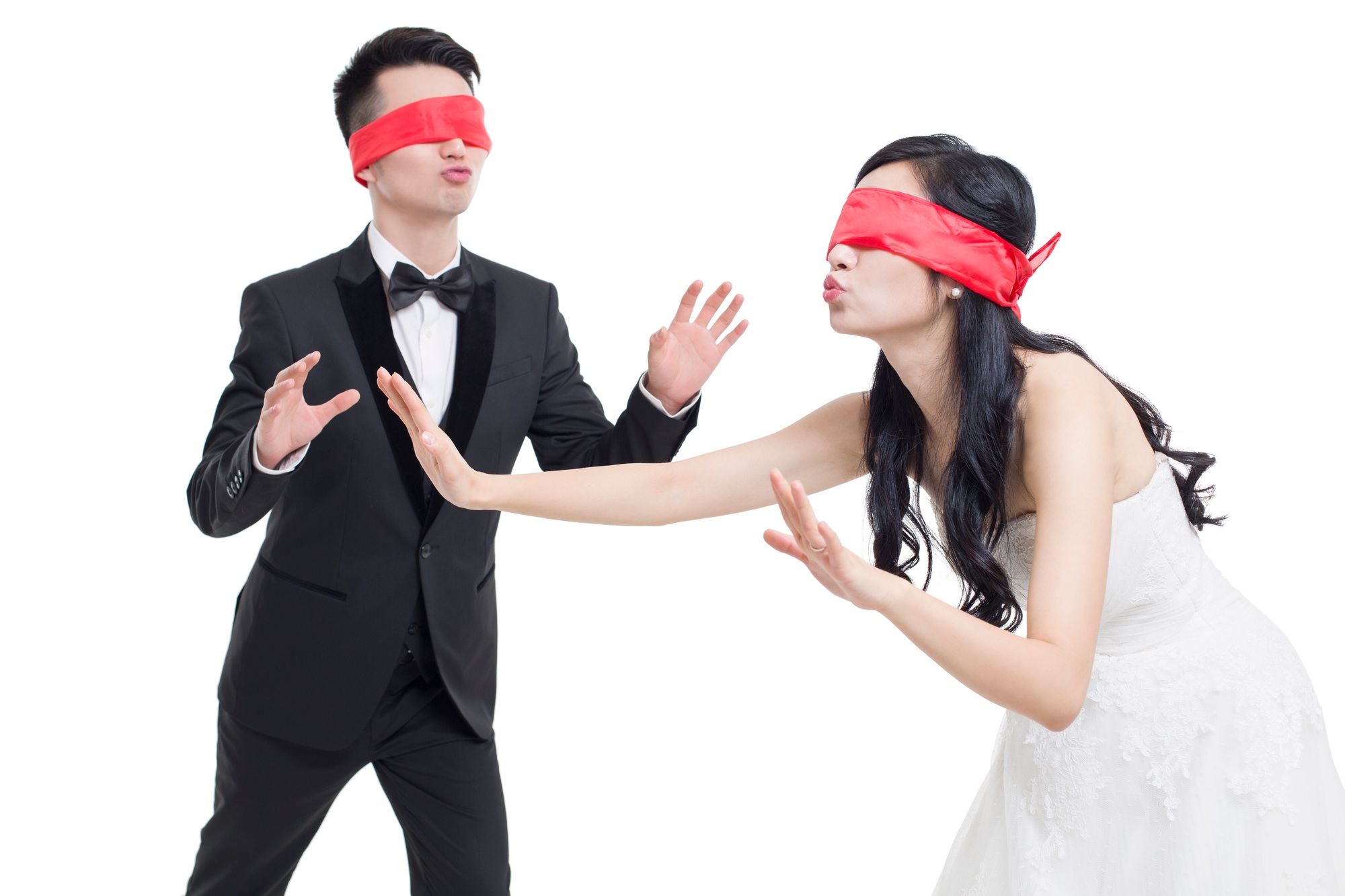 Happy bride and groom playing game together
